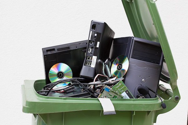 A person using asset disposal services to securely dispose of IT equipment